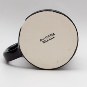 Handmade black ceramic mug with a white stripe